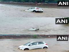 
      
      Vehicles float as water levels surge amid heavy rainfall 
      
      
