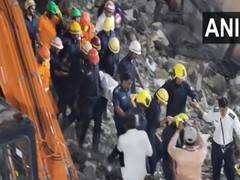 
      
      One dead, several others trapped after building collapses
      
      