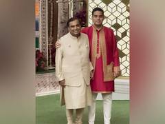 
      
      Mukesh Ambani poses with son Akash at Anant-Radhika’s event
      
      