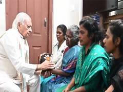 
      
      Kerala governor meets family of sanitation worker who fell into c
      
      
