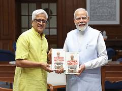 
      
      PM Modi signs copy of Dr R Balasubramaniam’s book
      
      