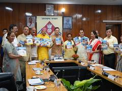 
      
      CM Dhami releases book 