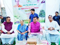 
      
      Uttarakhand CM Dhami plants sapling with mother on Guru Purnima
      
      