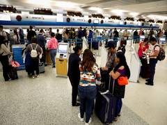 
      
      Woman stabbed at Miami International Airport, one held
      
      