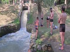 
      
      Residents of Kashmir's Anantnag seek relief at local ponds, canal
      
      