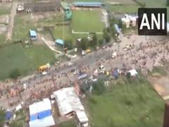
      
      Flowers showered from a helicopter on Kanwariyas in Meerut
      
      