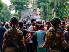 
      
      Violence continues in B'desh; mob storms jail, frees  500 inmates
      
      