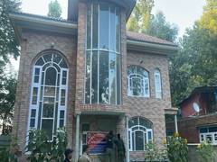 
      
      J-K: Police seize property of drug peddler worth crores in Kulgam
      
      