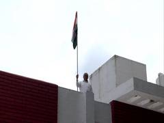 
      
      Gujarat CM hoists national flag at his residence 
      
      