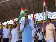 
      
         Law Minister Arjun Meghawal distributes Tiranga to students of
      
      