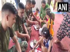 
      
      J-K:School girls tie Rakhi to army personnel
      
      