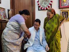 
      
      Women tie Rakhi to Uttarakhand CM Dhami at his residence 
      
      