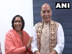
      
      Sadhvi Rithambara ties 'Rakhi' to Defence Minister Rajnath Singh
      
      