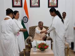 
      
      Sisters from Brahma Kumari Centre tie Rakhi to Governor 
      
      
