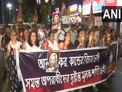 
      
      Kolkata rape-murder: Congress workers hold candle march
      
      