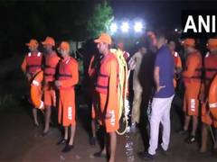 
      
      Trolley overturns while crossing flooded causeway on river amid h
      
      