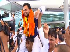 
      
      India's history-making Paralympians touch down in Delhi
      
      
