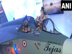 
      
      Ganpati idol seated on Tejas Fighter jet replica at Mumbai reside
      
      