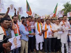 
      
      Karnataka: BJP holds protest demanding CM Siddaramaiah's
      
      