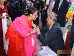 
      
      Nepal President to former King offer 'tika' to public 
      
      