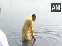 
      
      Delhi BJP President Virendra Sachdeva takes a dip in Yamuna river
      
      