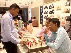 
      
      People visit jewellery stores in large numbers on Dhanteras
      
      