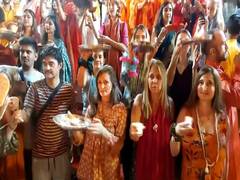 
      
      Foreign tourists perform aarti at Parmarth Niketan on Diwali
      
      