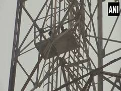 
      
      Two men climb tower to protest against rape-murder of girl 
      
      