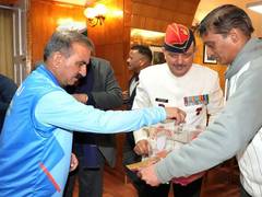 
      
      Brigadier Madan Sheel Sharma pins armed forces flag to Himachal CM
      
      
