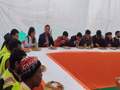 
      
      Maha Kumbh: Officials join ‘Swachhata Mitras’ during mass feast
      
      