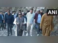 
      
      Uttarakhand CM Pushkar Singh Dhami treks with wife 
      
      