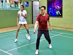 
      
      Kiren Rijiju plays badminton with PV Sindhu, Venkata Datta
      
      