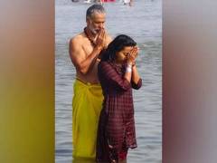 
      
      Actor-model Milind Soman takes dip in Sangam with wife Ankita
      
      