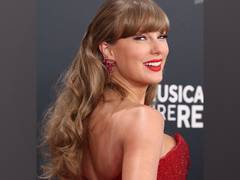 
      
      2025 Grammys: Swift hits the red carpet in a red-hot look
      
      