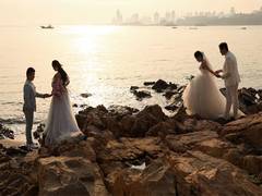 
      
      China's marriage rate drops to record low, while divorces on rise
      
      