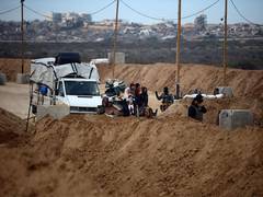 
      
      Israel issues warning as troops hold buffer zones in Gaza
      
      