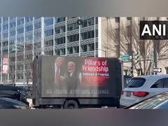 
      
      Mobile billboard truck board features PM Modi, Trump pictures
      
      
