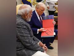 
      
      Prez Trump gifts PM Modi personalised book 