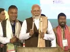 
    Prime Minister Narendra Modi beats traditional drum
    