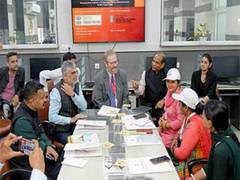 
      
      MIT Professor Jonathan Fleming interacts with Namo Drone Didis 
      
      