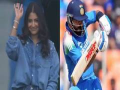 
    Anushka Sharma waves at Virat Kohli as she cheers for team India 
    