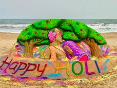 
      
      Sudarshan Pattnaik's 'Radha-Krishna' theme sand art on Holi
      
      