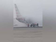 
      
      American Airlines plane catches fire in Denver
      
      