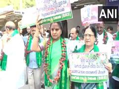 
      
      Kavitha protests with red chilli garland, demands MSP for farmers
      
      