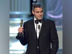 
      
      George Clooney says he is 
