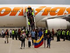 
      
      First flight of deported Venezuelans lands in Caracas 
      
      