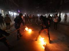 
      
      Protesters burn effigy of Nepal PM Oli; clash with police 
      
      