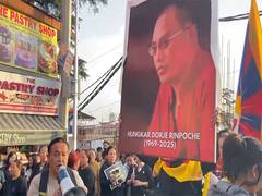 
      
      Tibetans in exile hold candlelight vigil over death of Rinpoche
      
      