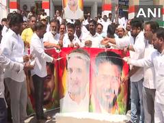 
      
      Cong workers pour milk over Rahul Gandhi, Revanth Reddy's poster
      
      