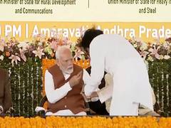 
      
      PM Modi gives chocolate to Andhra Deputy CM in Amravati
      
      